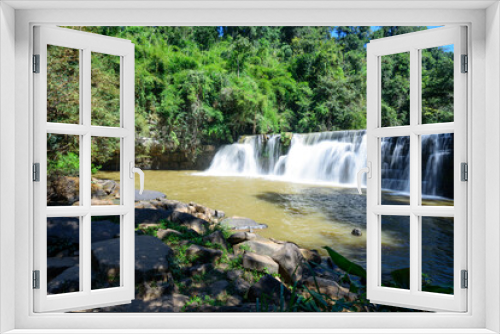 Fototapeta Naklejka Na Ścianę Okno 3D - Big waterfall in forest with sunlight