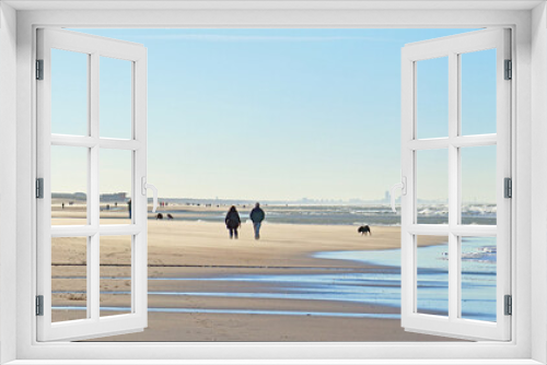 Fototapeta Naklejka Na Ścianę Okno 3D - Social distance on the beach: people having a walk on a windy day during the Covid lock-down in autumn 2020; Noordwijk, the Netherlands