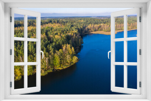 Fototapeta Naklejka Na Ścianę Okno 3D - Autumn lake landscape with pine trees, aerial bird-eye view