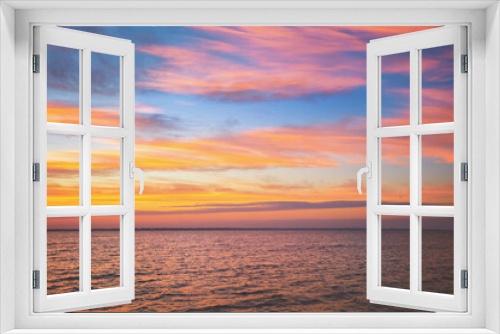 Fototapeta Naklejka Na Ścianę Okno 3D - Seascape. Seashore at dramatic blazing sunset. Landscape with sea and bright evening cloudy sky