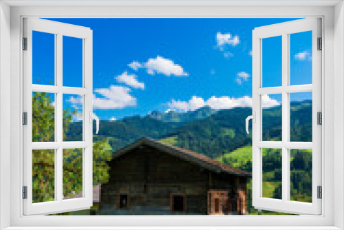 Fototapeta Naklejka Na Ścianę Okno 3D - Mountain house garden landscape. Mountain cabin garden. House in mountains. Mountain home scene