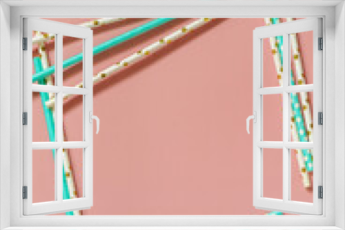 Fototapeta Naklejka Na Ścianę Okno 3D - A frame of Drinking paper straws for cocktails on pink background. Top view flat lay. Copy space.