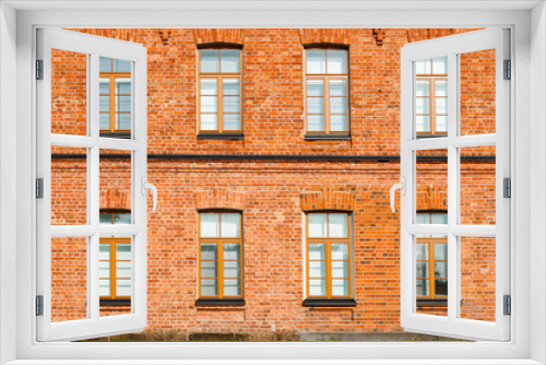 Fototapeta Naklejka Na Ścianę Okno 3D - Beautiful vintage red brick building at sunny day