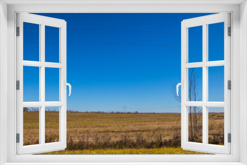Fototapeta Naklejka Na Ścianę Okno 3D - Clear blue sky and farm land