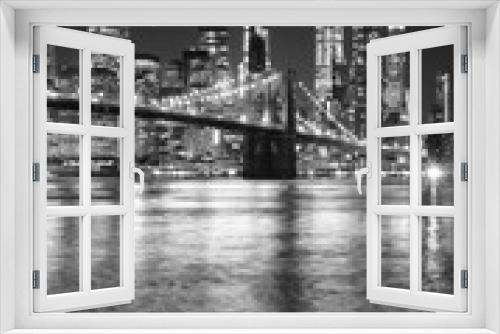 Fototapeta Naklejka Na Ścianę Okno 3D - Black and white night view of Manhattan waterfront, New York City, USA.