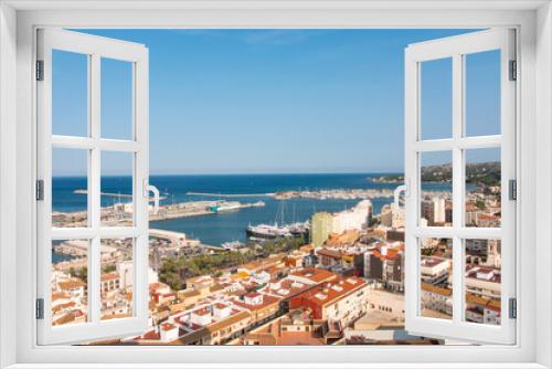 Denia cityscape, harbor (port) and seascape. Aerial view from the historic moorish castle mirador. Costa Blanca, Valencian community, Spain. 