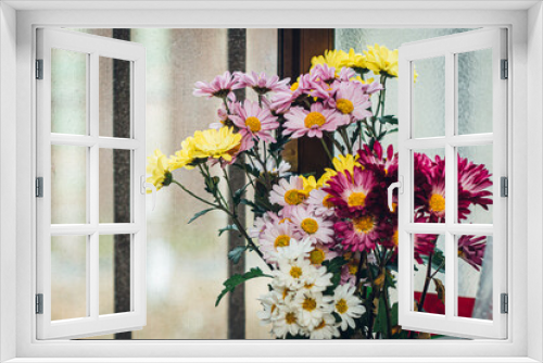 Fototapeta Naklejka Na Ścianę Okno 3D - Close-up of flowers by the window in the kitchen