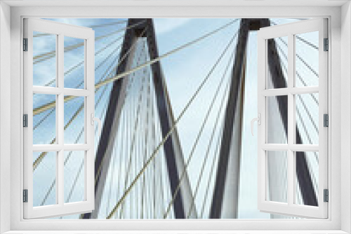 Fototapeta Naklejka Na Ścianę Okno 3D - close-up of a modern bridge against a blue sky