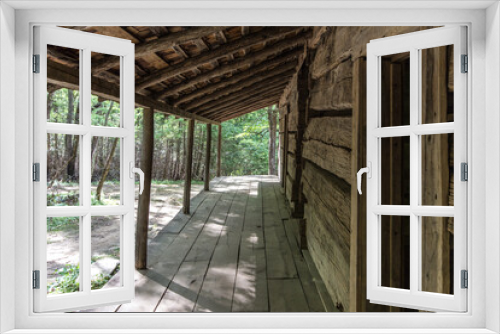 Fototapeta Naklejka Na Ścianę Okno 3D - Log cabin front porch of historical structure in the Great Smoky Mountain National Park.