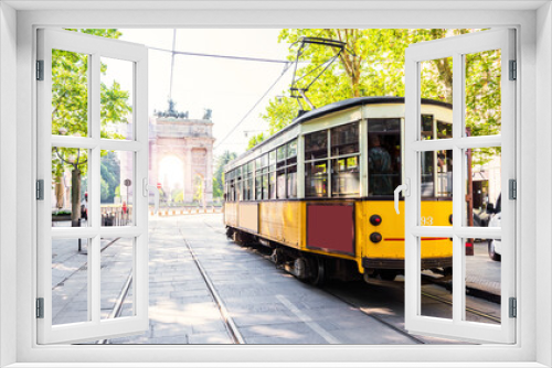 Fototapeta Naklejka Na Ścianę Okno 3D - Arch of Peace view with nostalgic yellow tram in MILANO, ITALY.