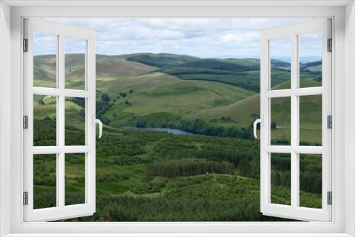 Fototapeta Naklejka Na Ścianę Okno 3D - View of Glendevon, Castlehill Reservoir and green Ochil Hills from the peak of a hill above Muckhart