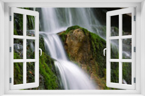 Fototapeta Naklejka Na Ścianę Okno 3D - Devils monument spring waterfall on cliff portrait