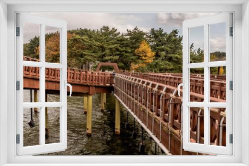 Fototapeta Naklejka Na Ścianę Okno 3D - Wooden footbridge over lake