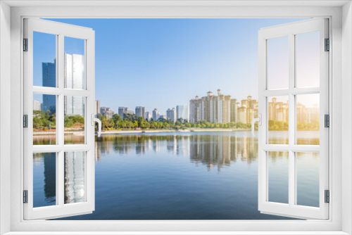 Fototapeta Naklejka Na Ścianę Okno 3D - High-rise residential buildings on the shore of Phoenix Lake Park, Nansha, Guangzhou