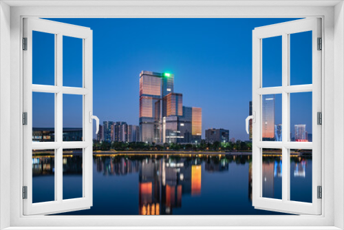 Fototapeta Naklejka Na Ścianę Okno 3D - Night view of CBD buildings in Nansha Free Trade Zone, Guangzhou, China
