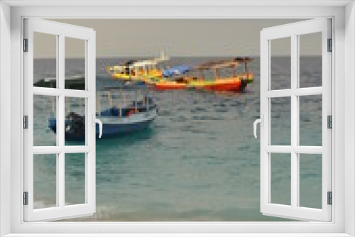 Fototapeta Naklejka Na Ścianę Okno 3D - Barcazas, amarilla y azul, en el mar de las islas Gili de Indonesia