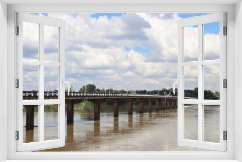 Fototapeta Naklejka Na Ścianę Okno 3D - Bridge over the river on a cloudy day