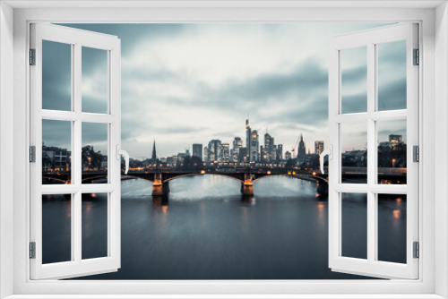 Fototapeta Naklejka Na Ścianę Okno 3D - Frankfuert is the only skyline in Germany. backlit photography for sunset with a great sky and lighting in the houses. High-rise buildings, city recording and finance