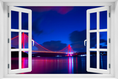 Fototapeta Naklejka Na Ścianę Okno 3D - Panoramic view of the Yavuz Sultan Selim Bridge with backlit in Istanbul, Turkey. Night time. Third Istanbul bridge.