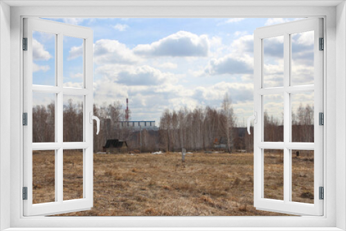 Fototapeta Naklejka Na Ścianę Okno 3D - industrial building nuclear power plant near a lonely apartment building in a field in the forest of stalkers