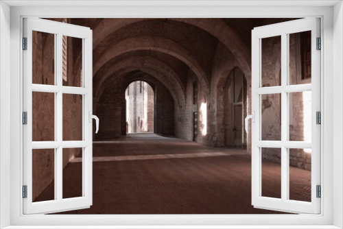 Fototapeta Naklejka Na Ścianę Okno 3D - Games of light that filters through the windows inside the Palazzo Ducale in Gubbio (Umbria, Italy, Europe)