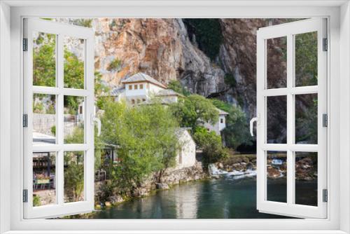 Fototapeta Naklejka Na Ścianę Okno 3D - Beautiful view of the Dervish House under the rock in Blagaj. Bosnia and Herzegovina