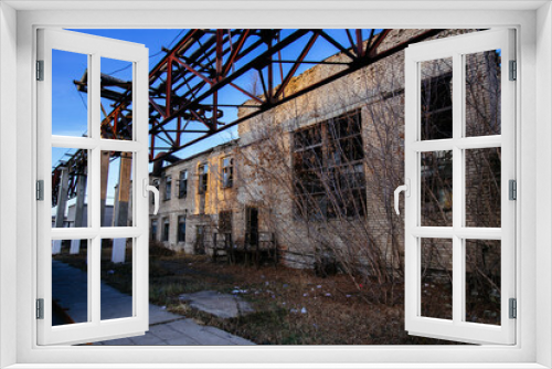 Fototapeta Naklejka Na Ścianę Okno 3D - Old abandoned industrial building waiting for demolition