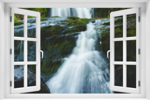 Fototapeta Naklejka Na Ścianę Okno 3D - Brilliant green waterfall in newfoundland