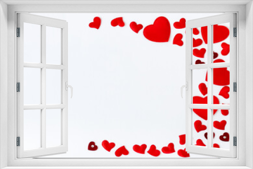 Frame of red hearts with space for text the centre on white background. Flat lay, top view Valentines Day background love concept.