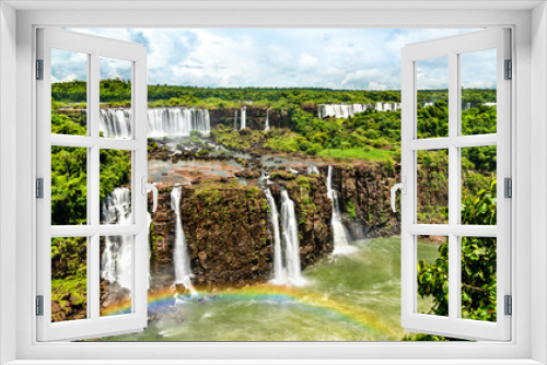 Fototapeta Naklejka Na Ścianę Okno 3D - Rainbow at Iguazu Falls, the largest waterfall in the world. UNESCO world heritage in Brazil and Argentina