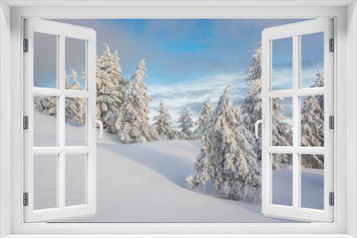 Fototapeta Naklejka Na Ścianę Okno 3D - Charming winter trees in the Carpathians. Christmas trees covered with frost and snow. Frosty weather. Photo of greeting cards. Christmas background. 