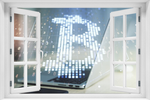 Double exposure of creative Bitcoin symbol hologram with computer on background. Mining and blockchain concept