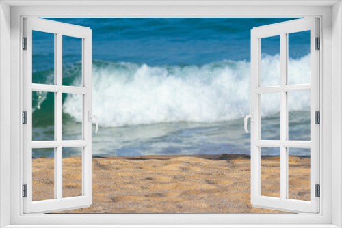Fototapeta Naklejka Na Ścianę Okno 3D - Breaking sea wave on a sandy beach background