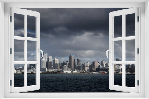 Fototapeta Naklejka Na Ścianę Okno 3D - Auckland city skyline with a dark cloud hanging in the sky above