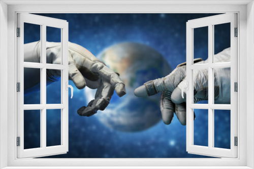 Fototapeta Naklejka Na Ścianę Okno 3D - Astronaut hands and on outer space background. Elements of this image furnished by NASA.