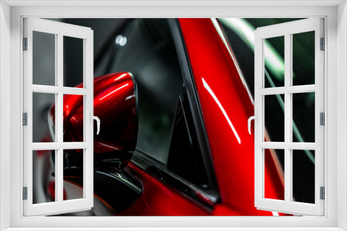 Fototapeta Naklejka Na Ścianę Okno 3D - Mirror and windshield of a new red car.