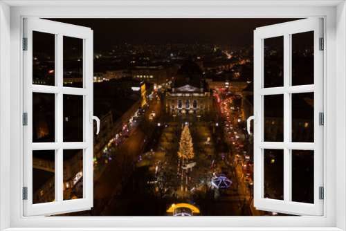 Fototapeta Naklejka Na Ścianę Okno 3D - Opening of Christmas tree near Opera House in Lviv, Ukraine. View from drone