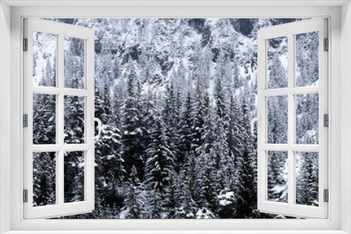 Fototapeta Naklejka Na Ścianę Okno 3D - Road through moody snowy pine forest in winter, snow fall. Winter in forest background