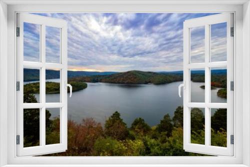 Fototapeta Naklejka Na Ścianę Okno 3D - Beautiful Hawn’s Overlook of Raystown Lake in the mountains of Pennsylvania, right before sunset with the sky swirled with blue, pink, purple and orange and the water smooth as glass.