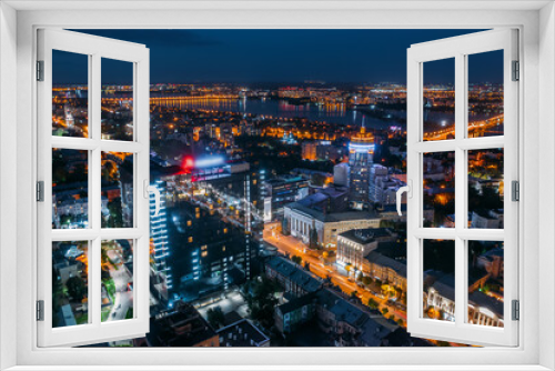 Fototapeta Naklejka Na Ścianę Okno 3D - Aerial view night city with illuminated roads, streets and modern buildings in downtown at night dusk.