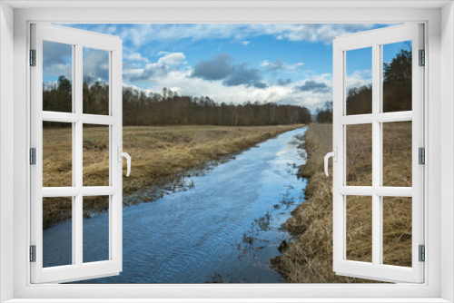 Fototapeta Naklejka Na Ścianę Okno 3D - A calm river and dry grasses on the banks