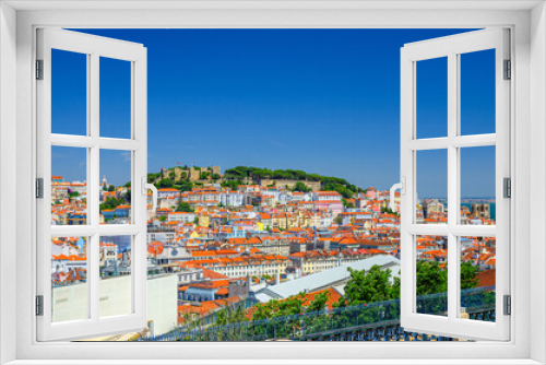Fototapeta Naklejka Na Ścianę Okno 3D - Lisbon cityscape, aerial panoramic view of Lisboa historical city centre with colorful buildings red tiled roofs, Sao Jorge Castle on hill and neighborhoods of Castelo, Mouraria and Alfama, Portugal.