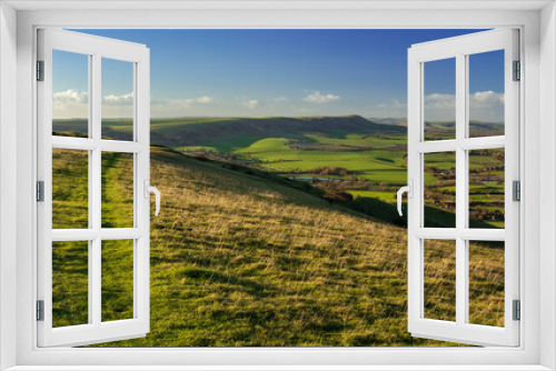 Fototapeta Naklejka Na Ścianę Okno 3D - The wonderful views across the East Sussex countryside and the South Downs from Wilmington Hill in south east England