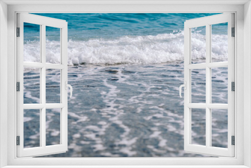 Fototapeta Naklejka Na Ścianę Okno 3D - White foamy waves on sandy beach closeup. Seaside on sunny summer day. Summer vacation time concept.