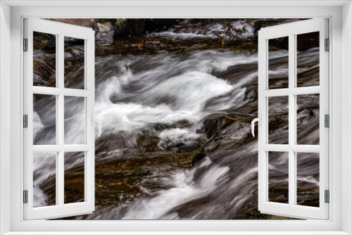Fototapeta Naklejka Na Ścianę Okno 3D - Close-up of the slow water flow of a mountain stream