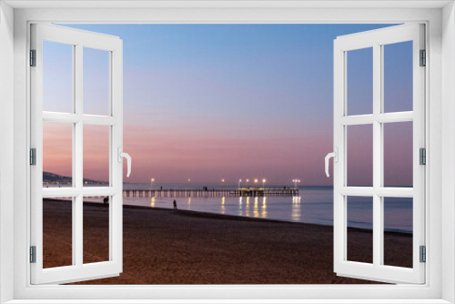 Fototapeta Naklejka Na Ścianę Okno 3D - sunset on the beach, pier and sea on the sunset