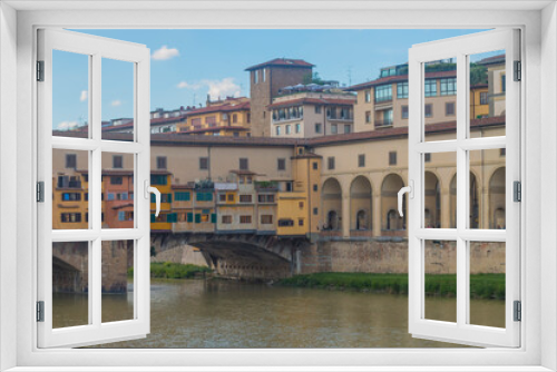 Fototapeta Naklejka Na Ścianę Okno 3D - View of medieval stone bridge Ponte Vecchio and the Arno River from the Ponte Santa Trinita (Holy Trinity Bridge) in Florence, Tuscany, Italy. Florence is a popular tourist destination of Europe