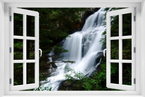 Fototapeta Naklejka Na Ścianę Okno 3D - large soft flowing waterfall in the green forest