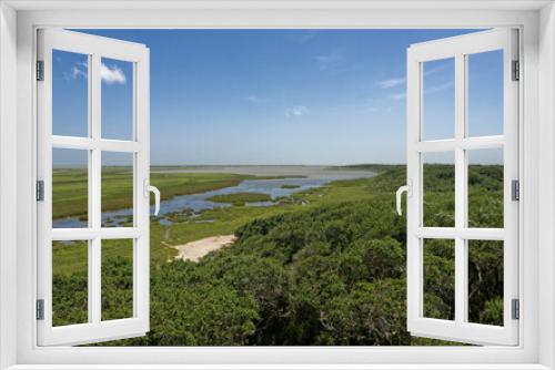 Fototapeta Naklejka Na Ścianę Okno 3D - The Wetlands of the Aransas National wildlife Refuge running towards the Gulf Coast near to Rockport with a blue Sky above.
