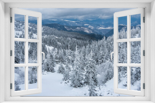 Fototapeta Naklejka Na Ścianę Okno 3D - fir trees  and mountains covered with snow. beautiful winter landscape